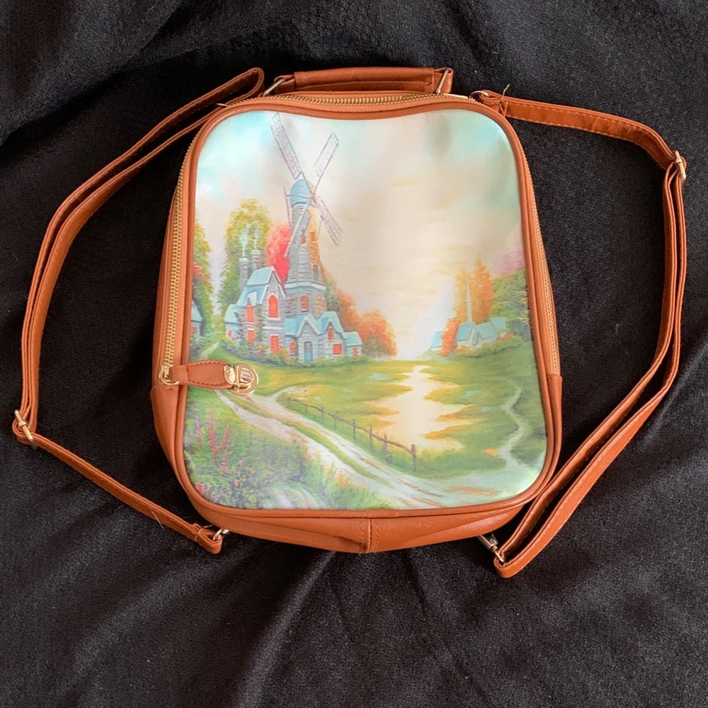 Backpack (no brand found) with Dutch windmill scene; approximately 12”x10”